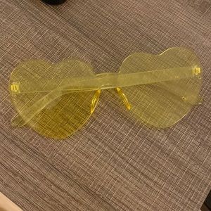 I am selling yellow clear glasses shaped as a heart